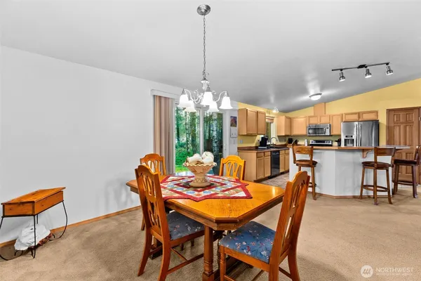 a view of a dining room with furniture window and outside view