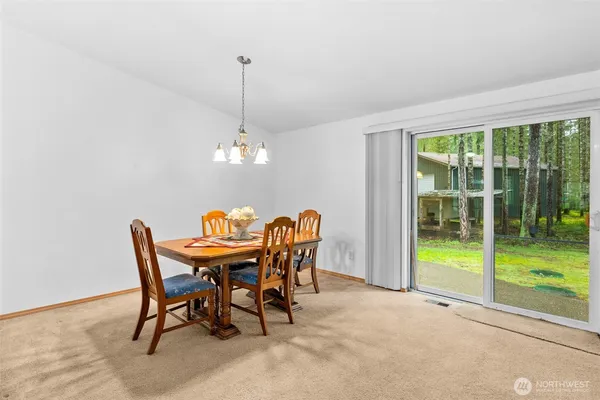 a view of a dining room with furniture window and outside view