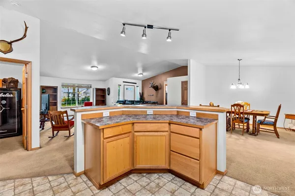 a kitchen with stainless steel appliances granite countertop a sink and cabinets