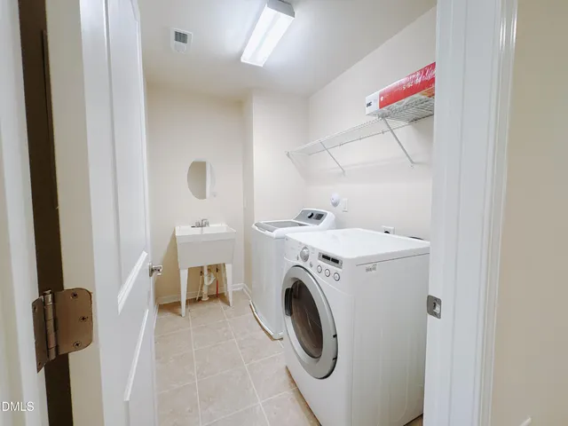a spacious bathroom with a shower sink double vanity and a mirror