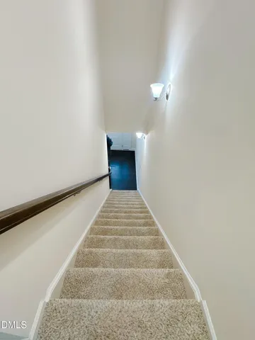 a view of backyard with plants and outdoor seating
