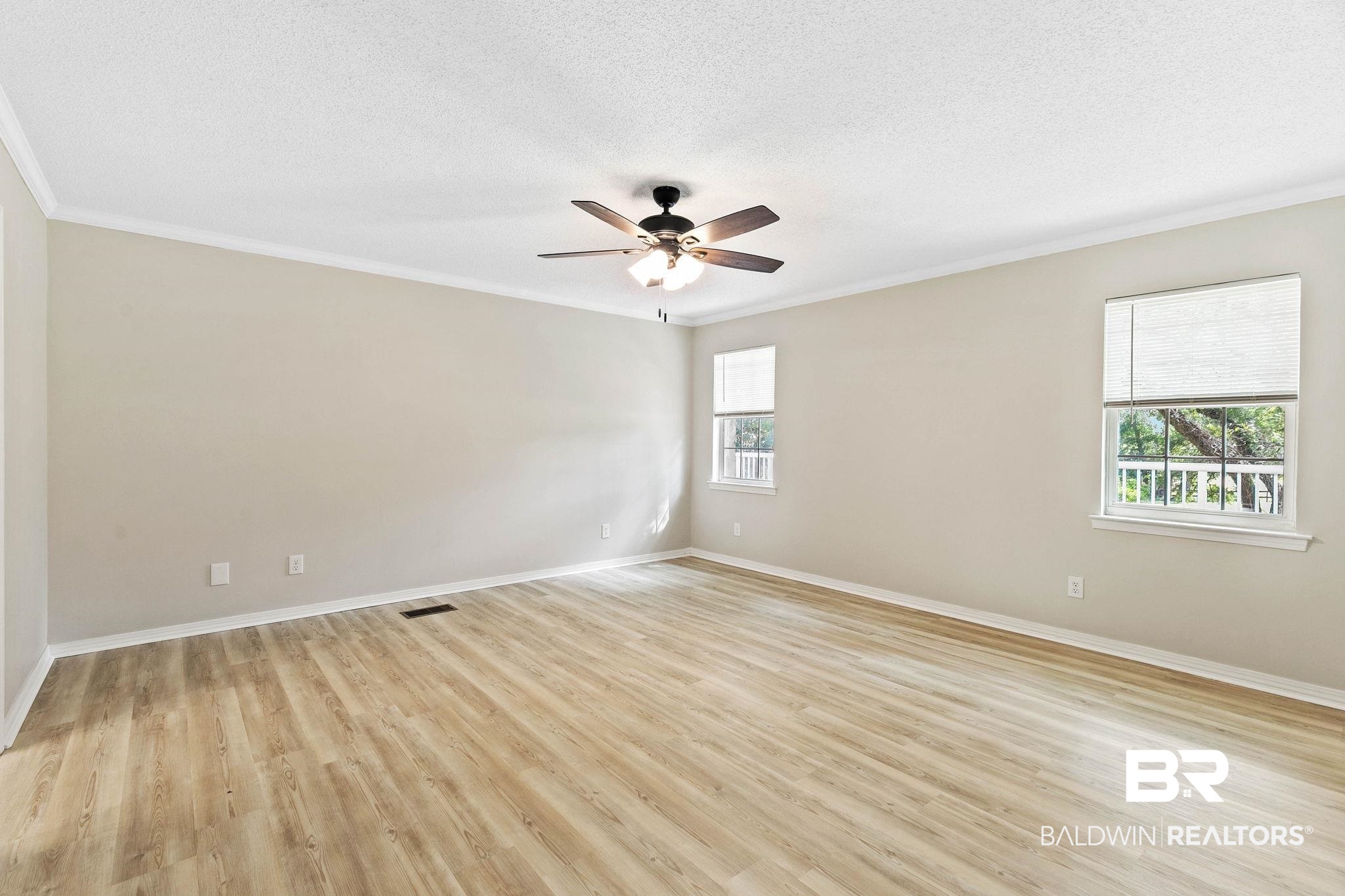 35650 Spring Road North Stapleton, AL 36578 - Photo 33 of 70 Spare room featuring ornamental molding, light wood finished floors, a textured ceiling, and a ceiling fan