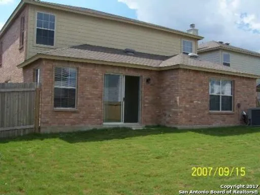 a brick house with a yard