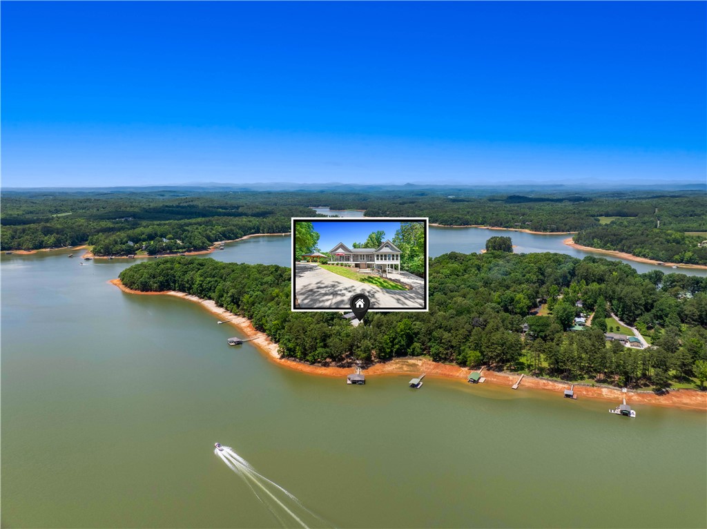 285 Bertha Allen Road Westminster, SC 29693 - Photo 5 of 50 Discover expansive lake frontage with private docks and lush green surroundings.