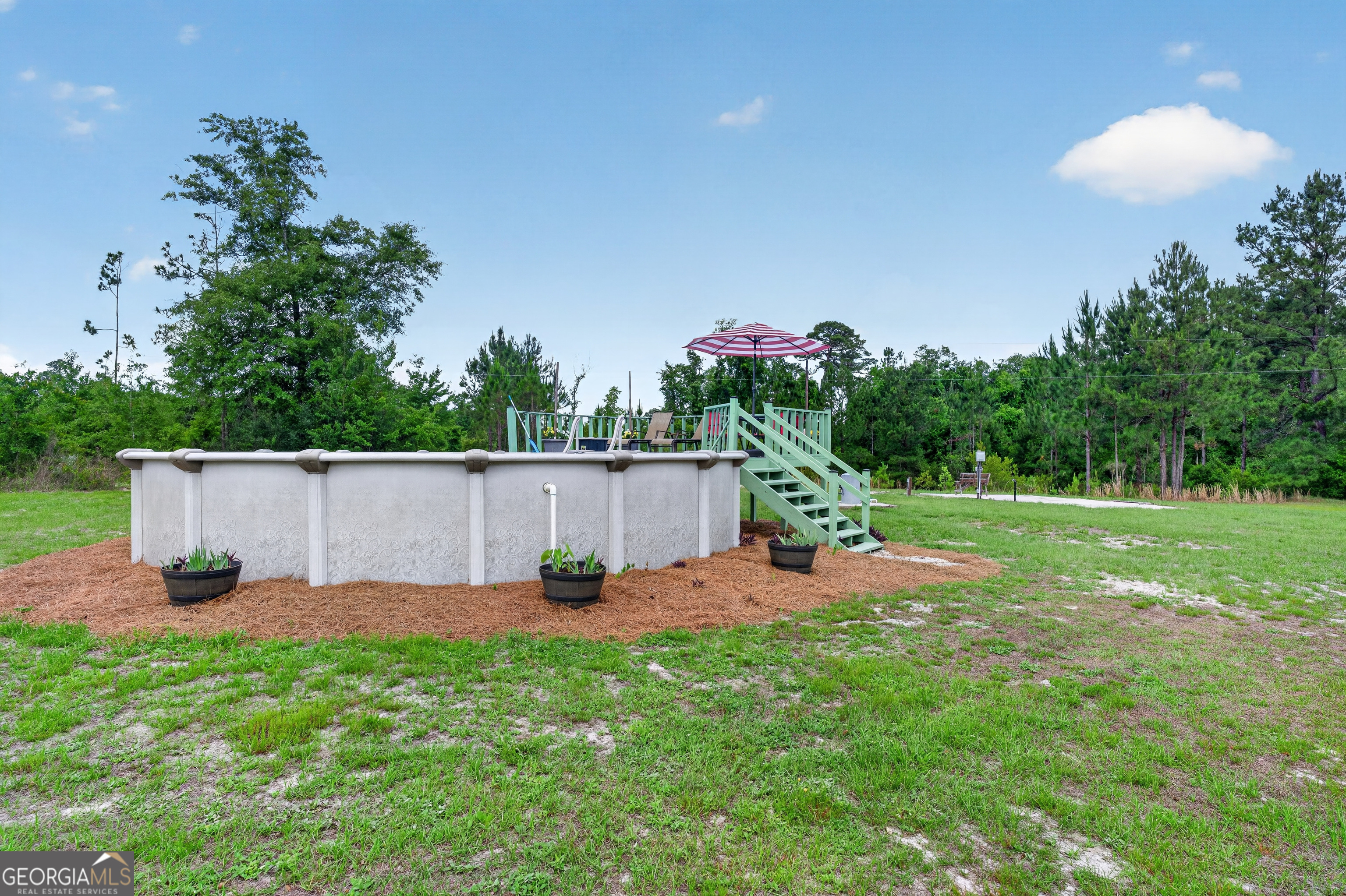 1953 Raybon Road West Hoboken, GA 31542 - Photo 26 of 31 a view of a chair and table in the garden