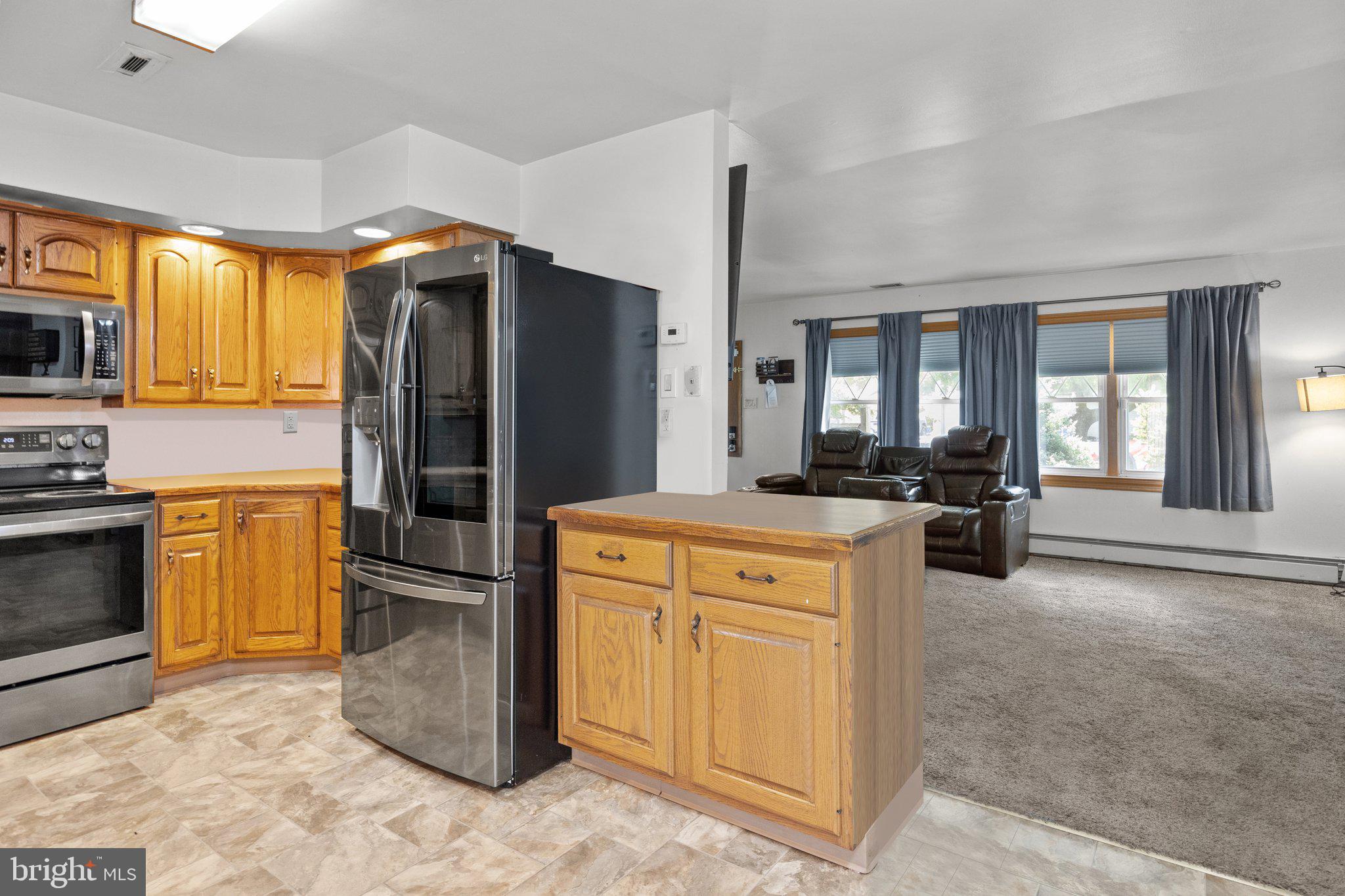 10 Jump Hill Road Levittown, PA 19056 - Photo 9 of 26 Kitchen view into Living Room