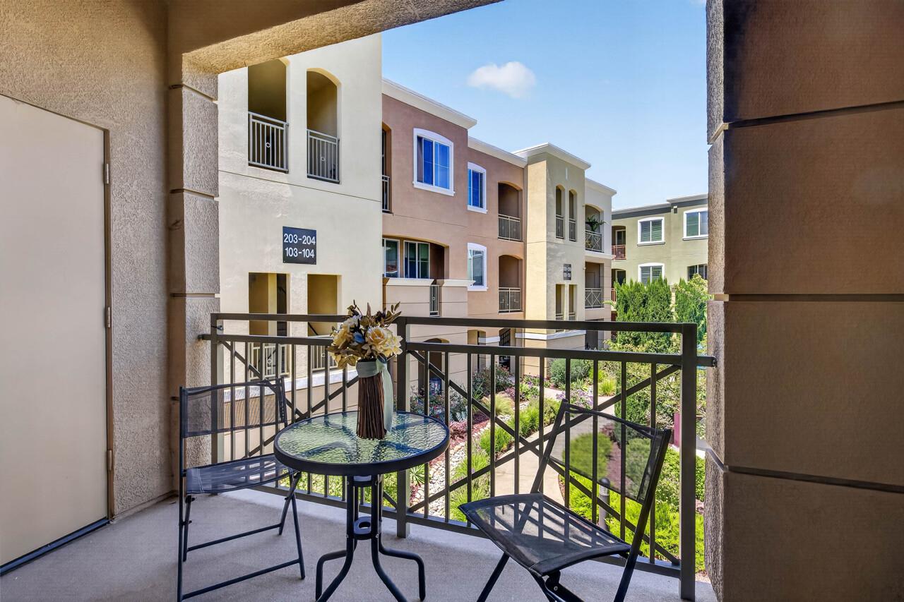 4712 Norris Canyon Road, Unit 104 San Ramon, CA 94583 - Photo 5 of 22 a view of a chairs and table in the balcony