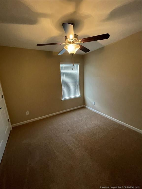 261 River Oaks St Spring Lake Spring Lake, NC 28390 - Photo 22 of 38 a view of a livingroom with a ceiling fan and window