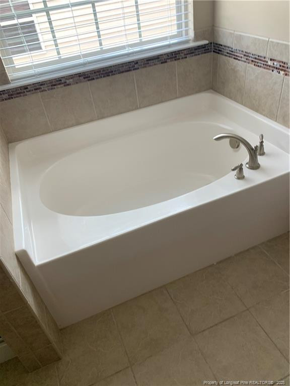 261 River Oaks St Spring Lake Spring Lake, NC 28390 - Photo 24 of 38 a bath tub sitting next to a window