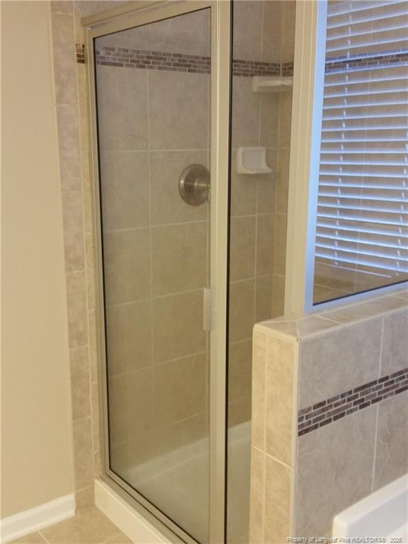 261 River Oaks St Spring Lake Spring Lake, NC 28390 - Photo 27 of 38 a bathroom with a glass shower door