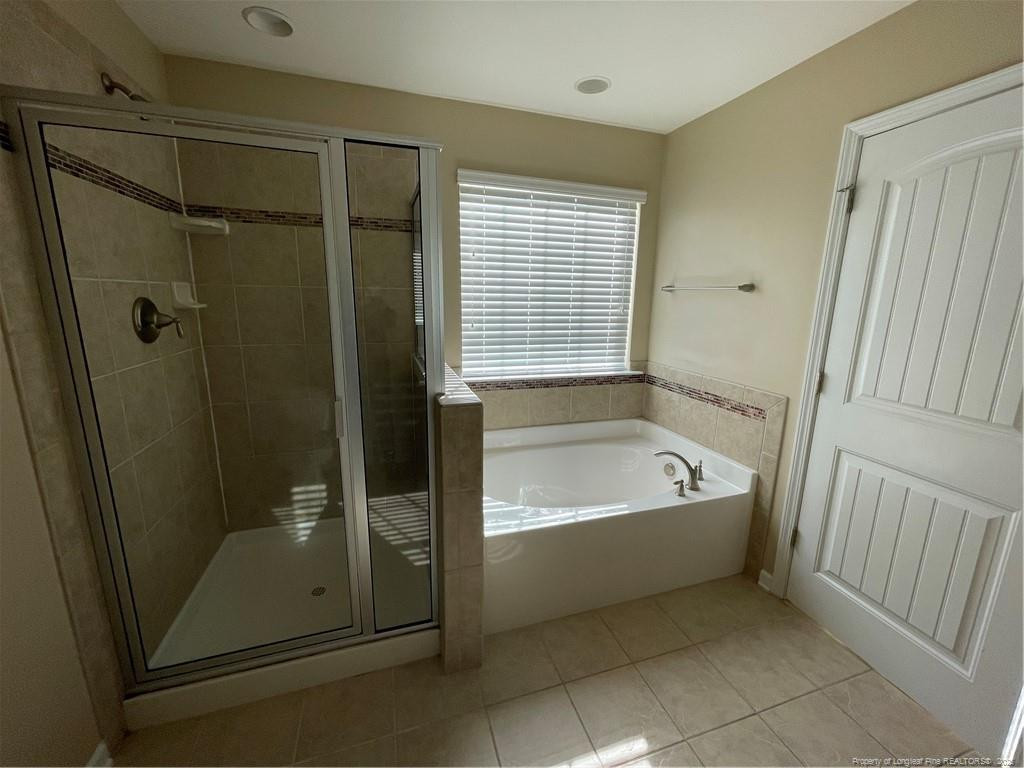 261 River Oaks St Spring Lake Spring Lake, NC 28390 - Photo 28 of 38 a bathroom with a shower a bathtub and a shower