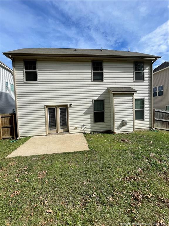 261 River Oaks St Spring Lake Spring Lake, NC 28390 - Photo 34 of 38 a front view of a house with a yard