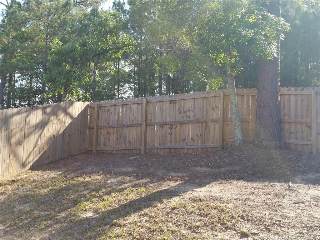 261 River Oaks St Spring Lake Spring Lake, NC 28390 - Photo 36 of 38 a view of a backyard of the house