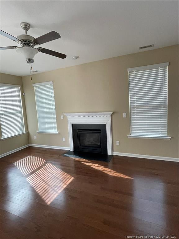 261 River Oaks St Spring Lake Spring Lake, NC 28390 - Photo 6 of 38 an empty room with windows and fireplace