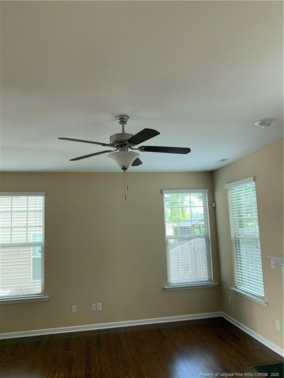 261 River Oaks St Spring Lake Spring Lake, NC 28390 - Photo 10 of 38 an empty room with wooden floor and windows