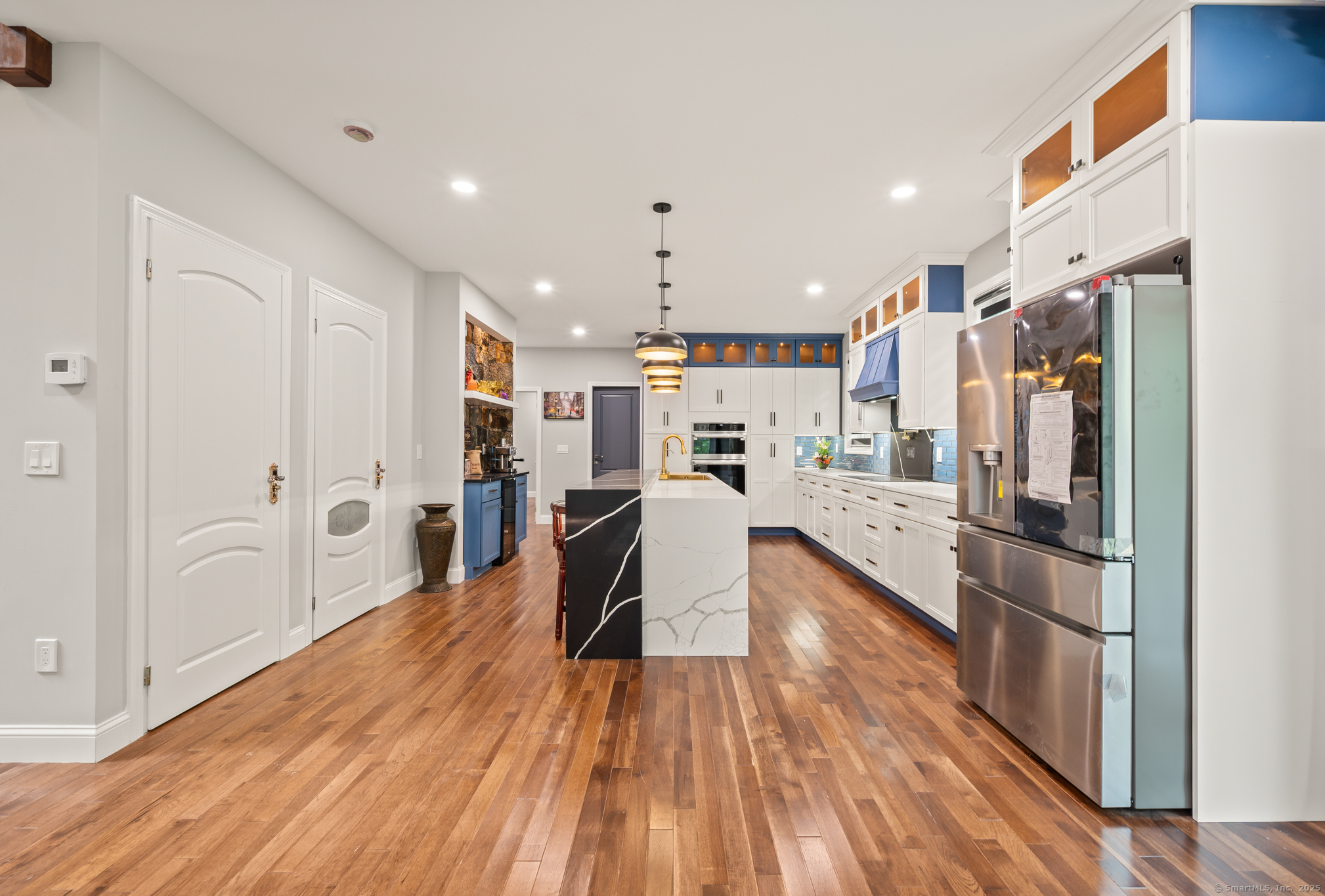 370 West Mountain Road West Simsbury, CT 06092 - Photo 11 of 39 a open kitchen with stainless steel appliances granite countertop a refrigerator and microwave
