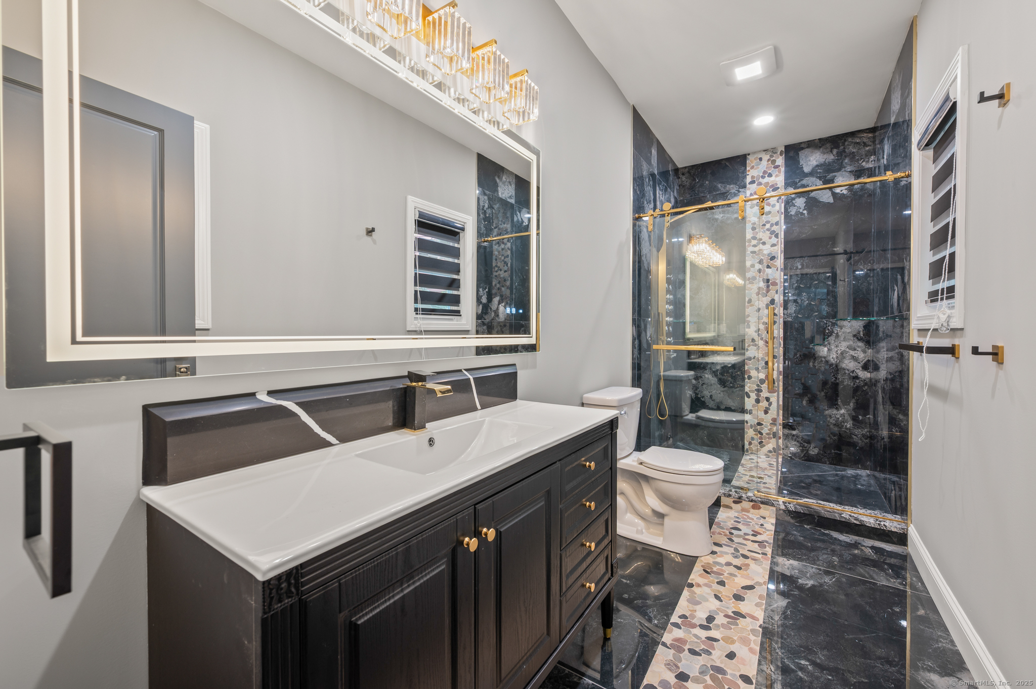 370 West Mountain Road West Simsbury, CT 06092 - Photo 17 of 39 a bathroom with a sink toilet and shower