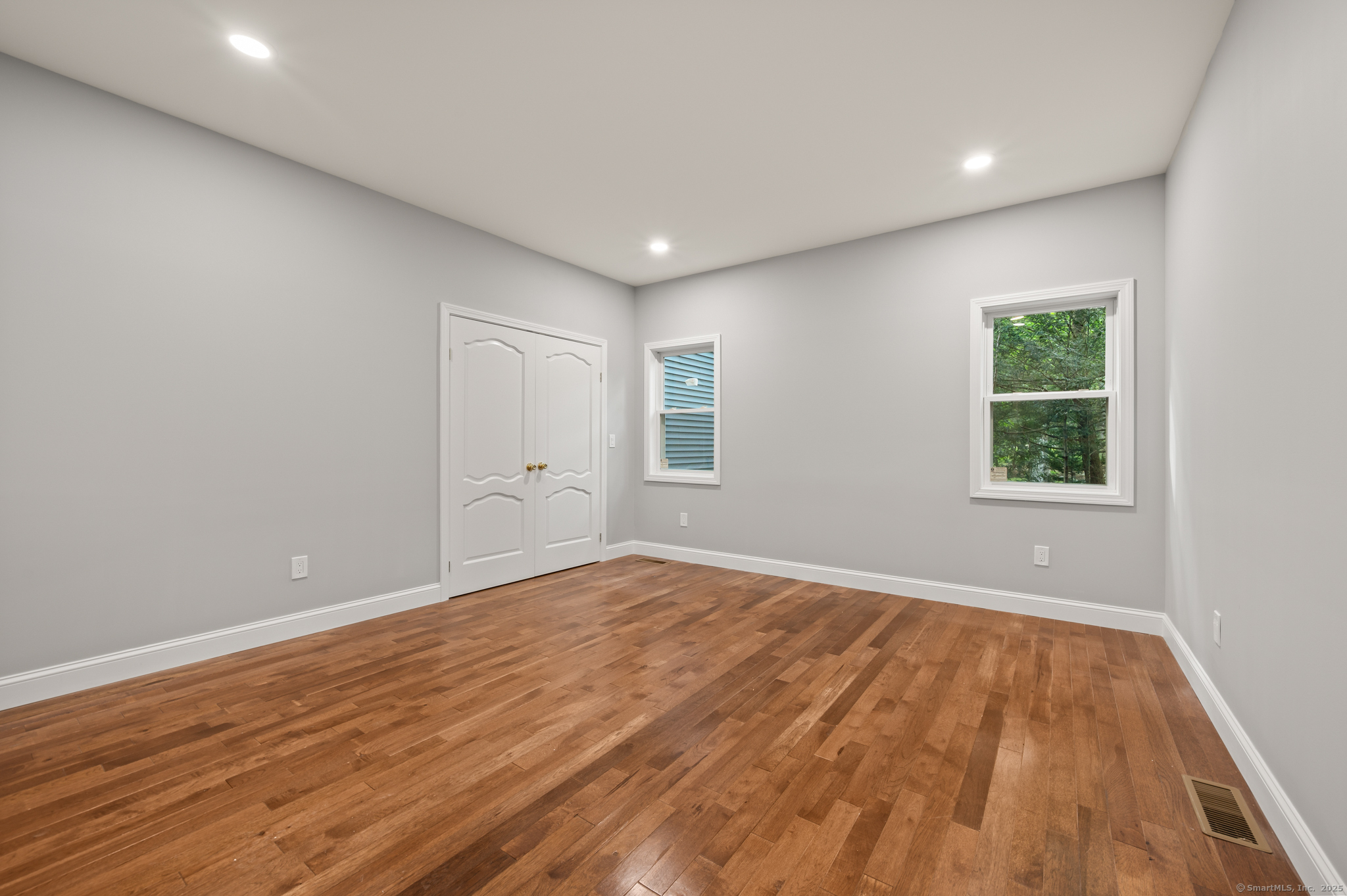 370 West Mountain Road West Simsbury, CT 06092 - Photo 18 of 39 a view of empty room with wooden floor and fan