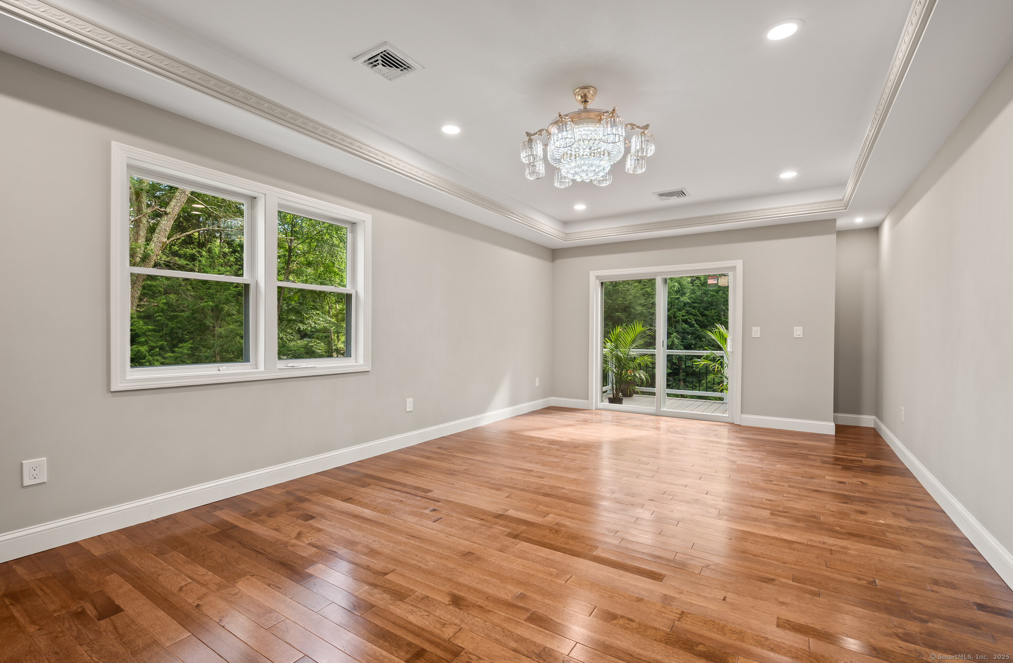 370 West Mountain Road West Simsbury, CT 06092 - Photo 20 of 39 a view of an empty room with wooden floor and a window