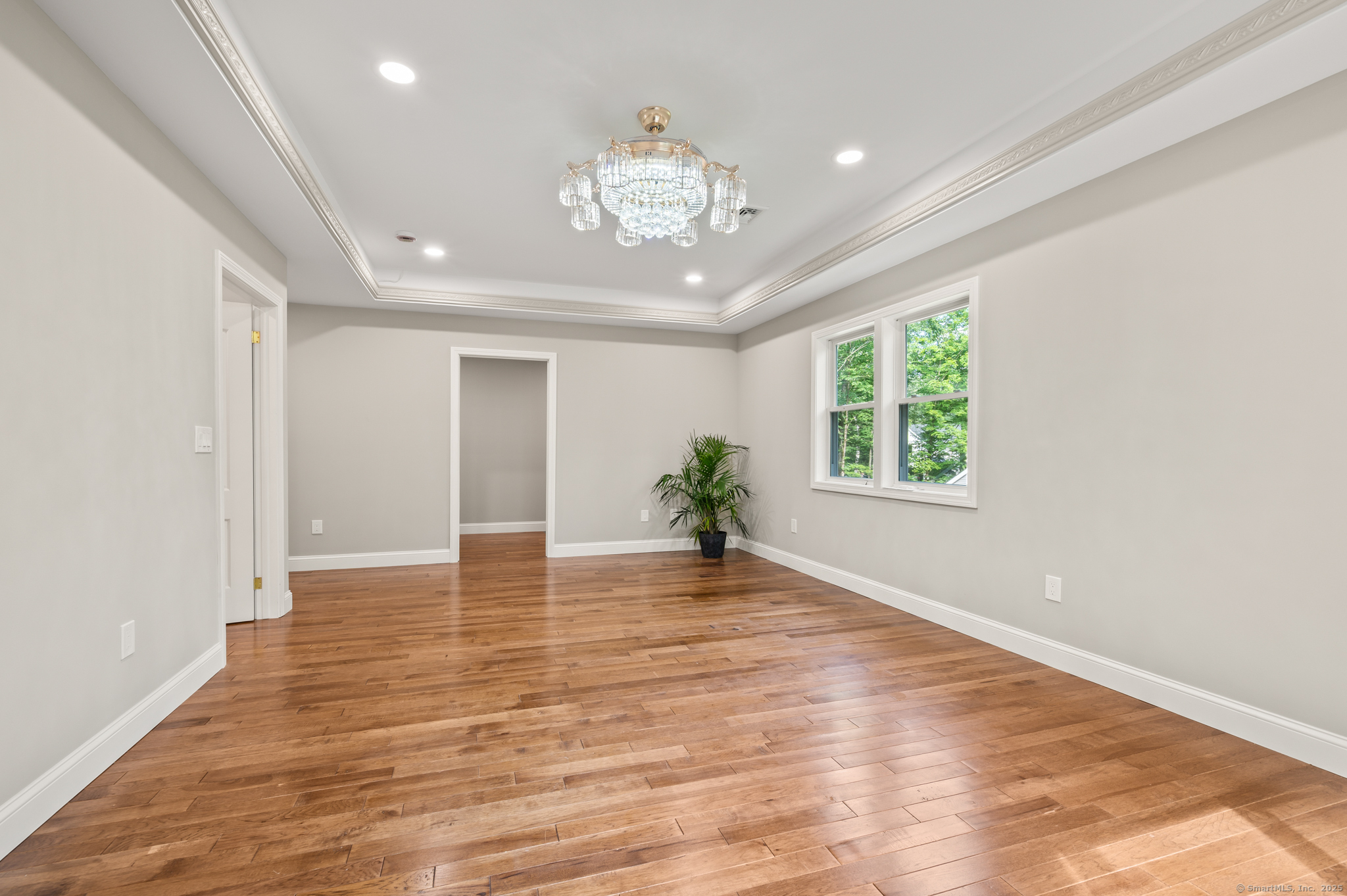 370 West Mountain Road West Simsbury, CT 06092 - Photo 23 of 39 a view of an empty room with wooden floor and a window