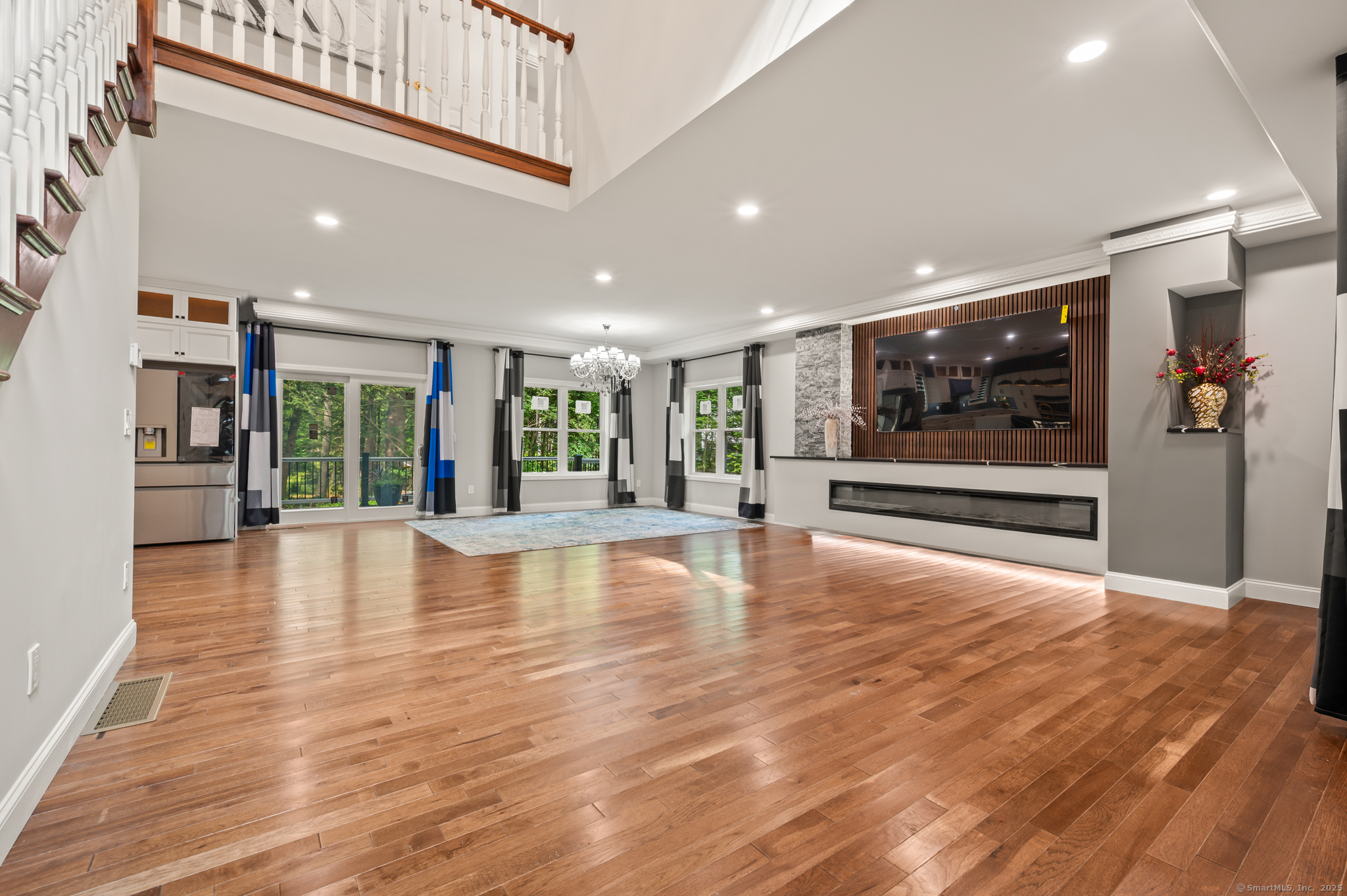 370 West Mountain Road West Simsbury, CT 06092 - Photo 3 of 39 a view of an empty room with wooden floor and windows