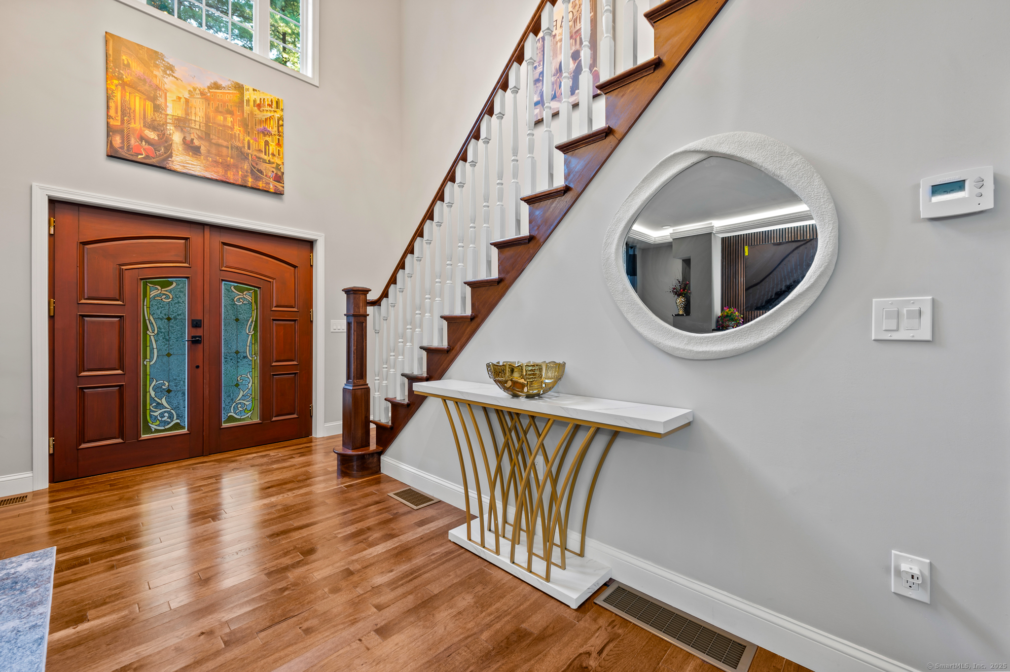 370 West Mountain Road West Simsbury, CT 06092 - Photo 7 of 39 a view of entryway with wooden floor and a front door