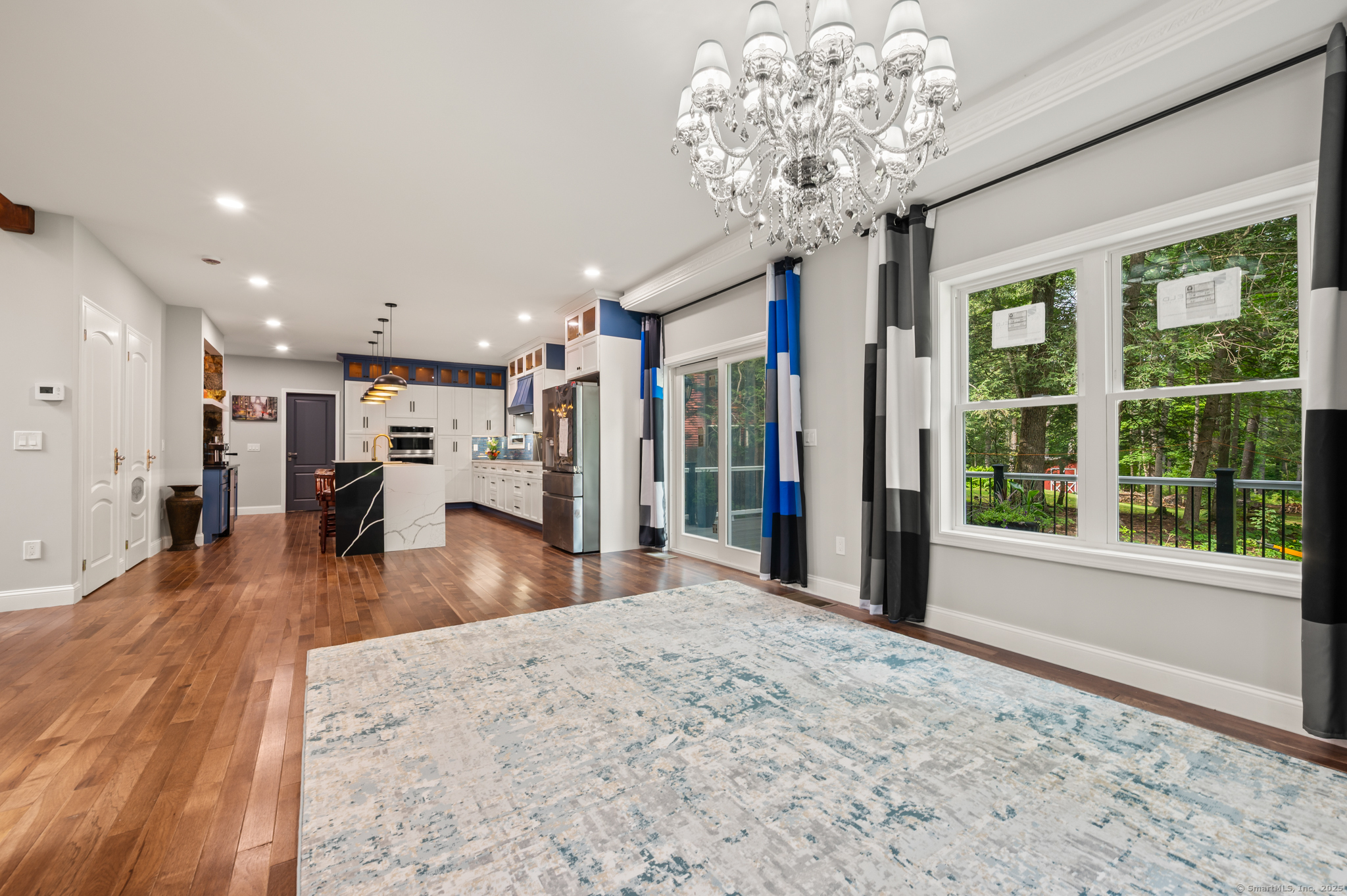 370 West Mountain Road West Simsbury, CT 06092 - Photo 10 of 39 a view of a room with wooden floor and a large window