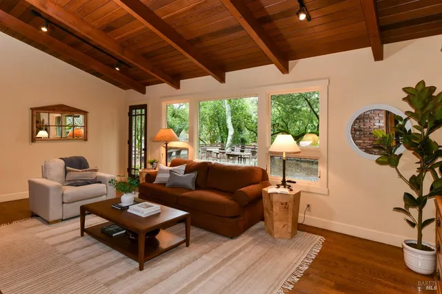 a view of hallway with wooden floor and stairs
