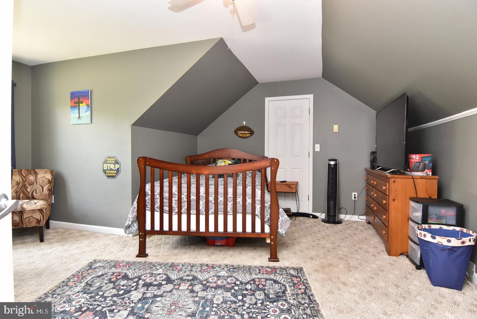 24531 Shortly Road Georgetown, DE 19947 - Photo 26 of 30 a bedroom with furniture and a rug