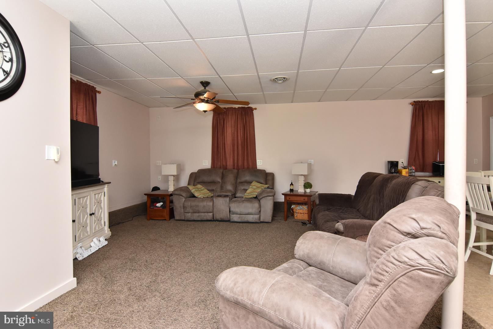 24531 Shortly Road Georgetown, DE 19947 - Photo 10 of 30 a living room with furniture and a flat screen tv