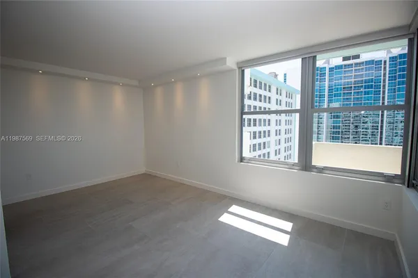 a view of an empty room with a window