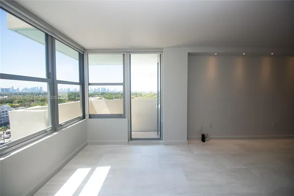 a view of an empty room with a window