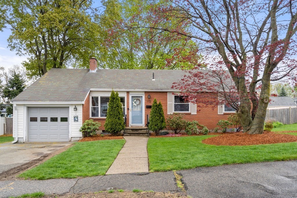 front view of a house with a yard