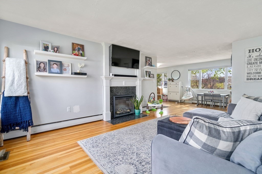 172 Circle Drive Waltham, MA 02452 - Photo 12 of 23 a living room with furniture and a fireplace