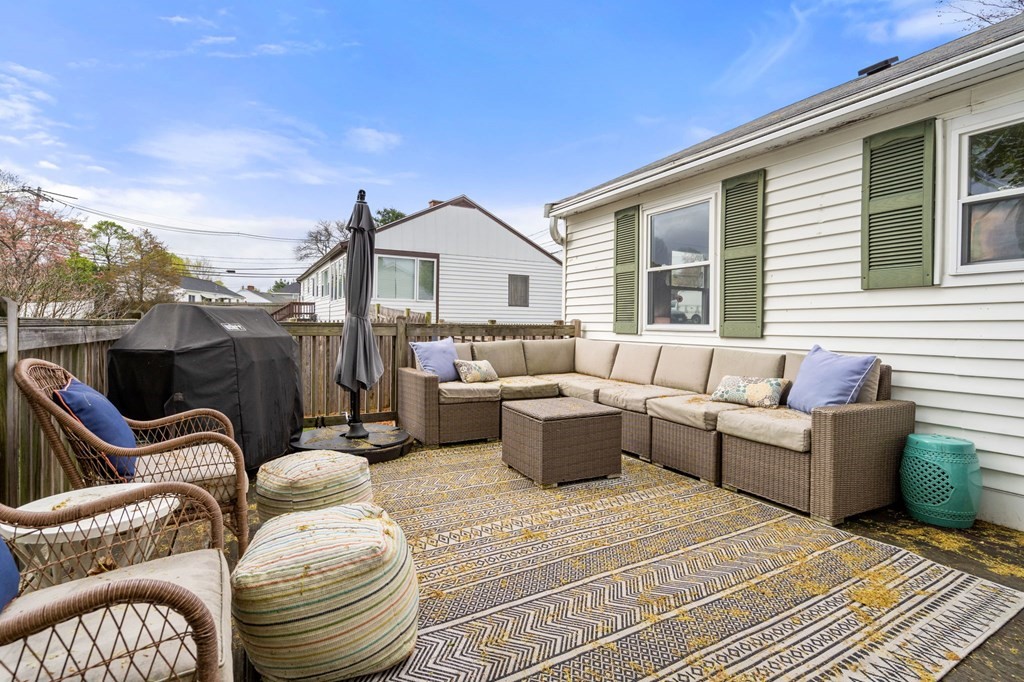 172 Circle Drive Waltham, MA 02452 - Photo 17 of 23 a view of a patio with couches chairs and wooden floor