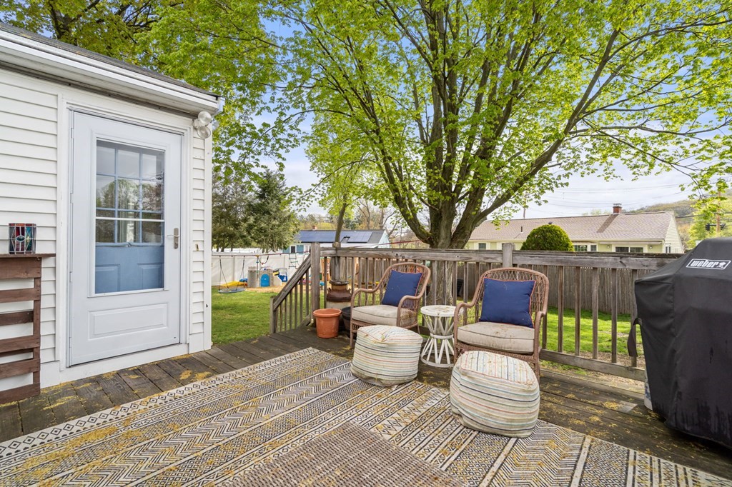 172 Circle Drive Waltham, MA 02452 - Photo 18 of 23 a view of a patio with couches chairs and a wooden floor