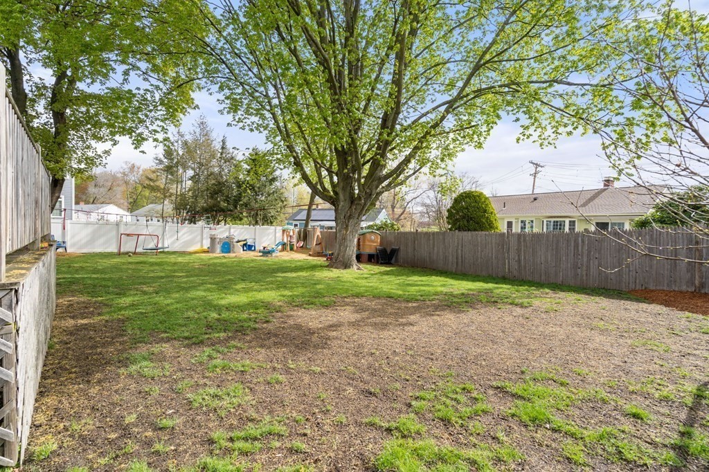 172 Circle Drive Waltham, MA 02452 - Photo 23 of 23 a view of a yard with a house and a large tree