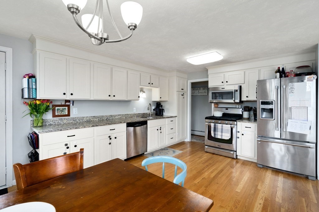 172 Circle Drive Waltham, MA 02452 - Photo 5 of 23 a kitchen with stainless steel appliances granite countertop a refrigerator sink and stove