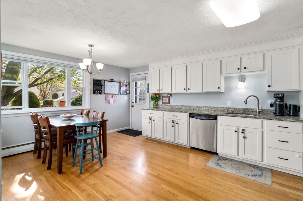 172 Circle Drive Waltham, MA 02452 - Photo 6 of 23 a kitchen with stainless steel appliances granite countertop a white cabinets and wooden floor