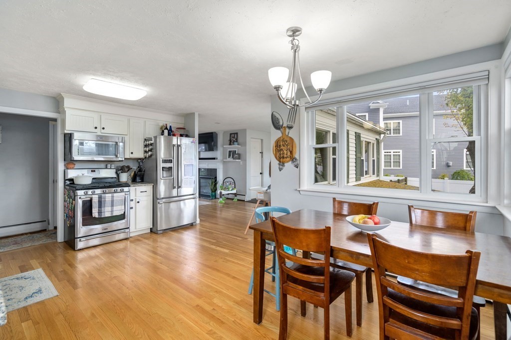 172 Circle Drive Waltham, MA 02452 - Photo 7 of 23 a view of a dining room with furniture and a chandelier