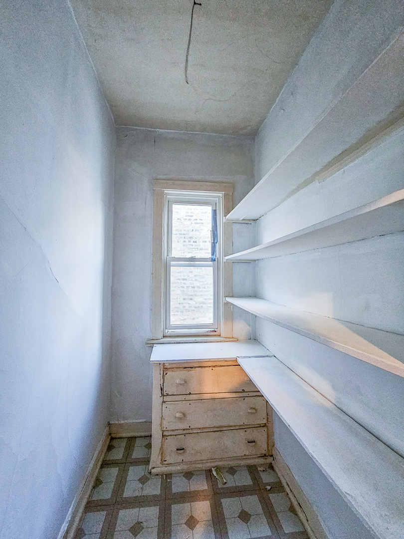 3338 West Cullom Avenue, Unit 2 Chicago, IL 60618 - Photo 13 of 15 a view of room with window and wooden floor