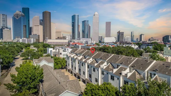 a view of a city with tall buildings