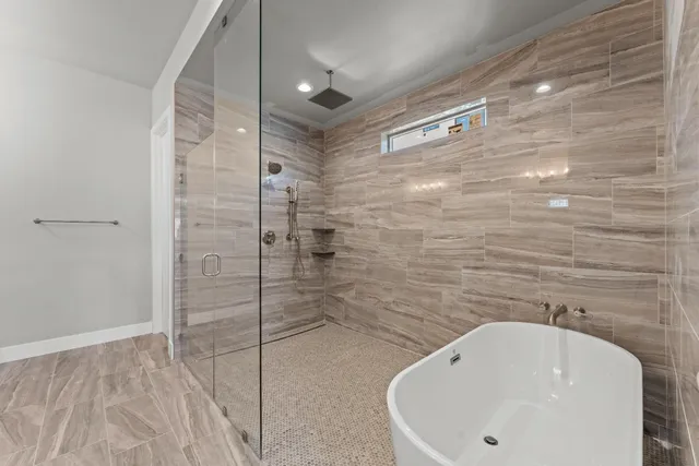 a spacious bathroom with a double vanity sink and a mirror