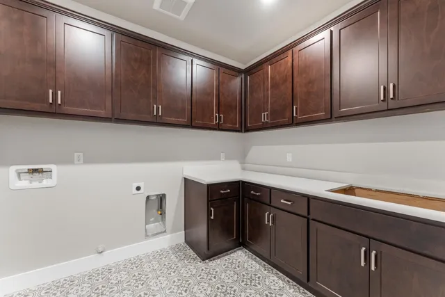 an empty room with windows and entrance