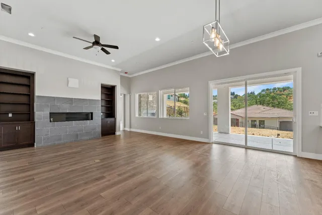 a view of kitchen and kitchen with furniture wooden floor and window