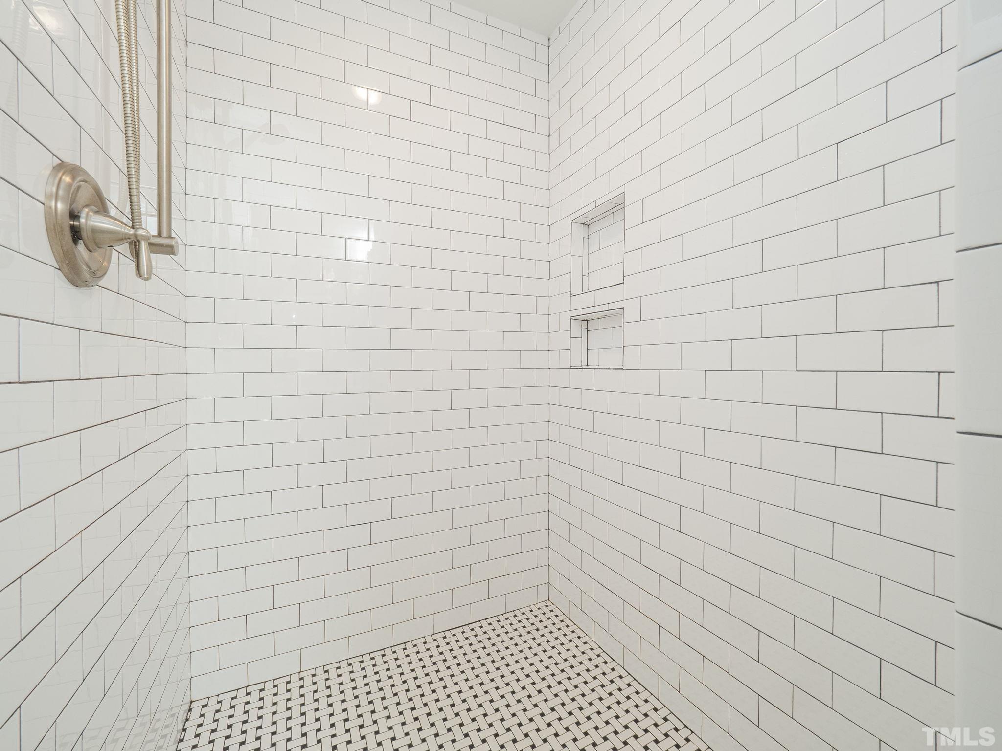15 Bart Street Raleigh, NC 27610 - Photo 14 of 28 a bathroom with a shower