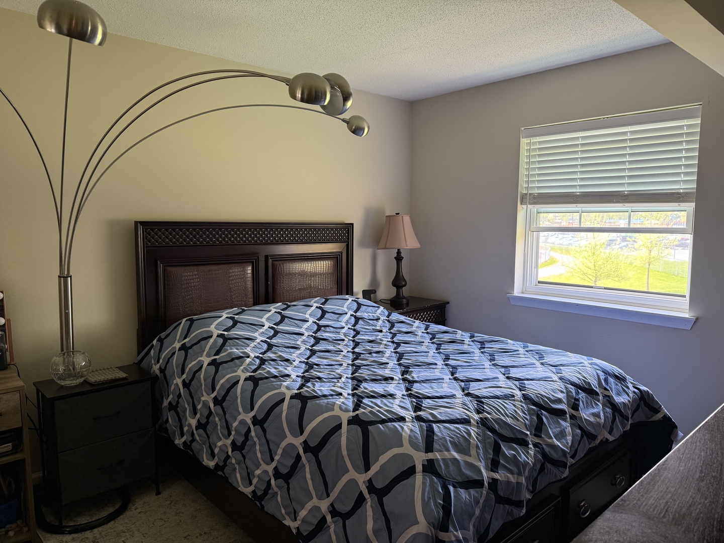 740 Weidner Road, Unit 206 Buffalo Grove, IL 60089 - Photo 12 of 24 a bedroom with a bed and a window