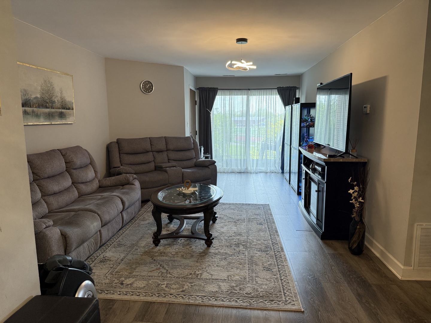 740 Weidner Road, Unit 206 Buffalo Grove, IL 60089 - Photo 3 of 24 a living room with furniture and a window