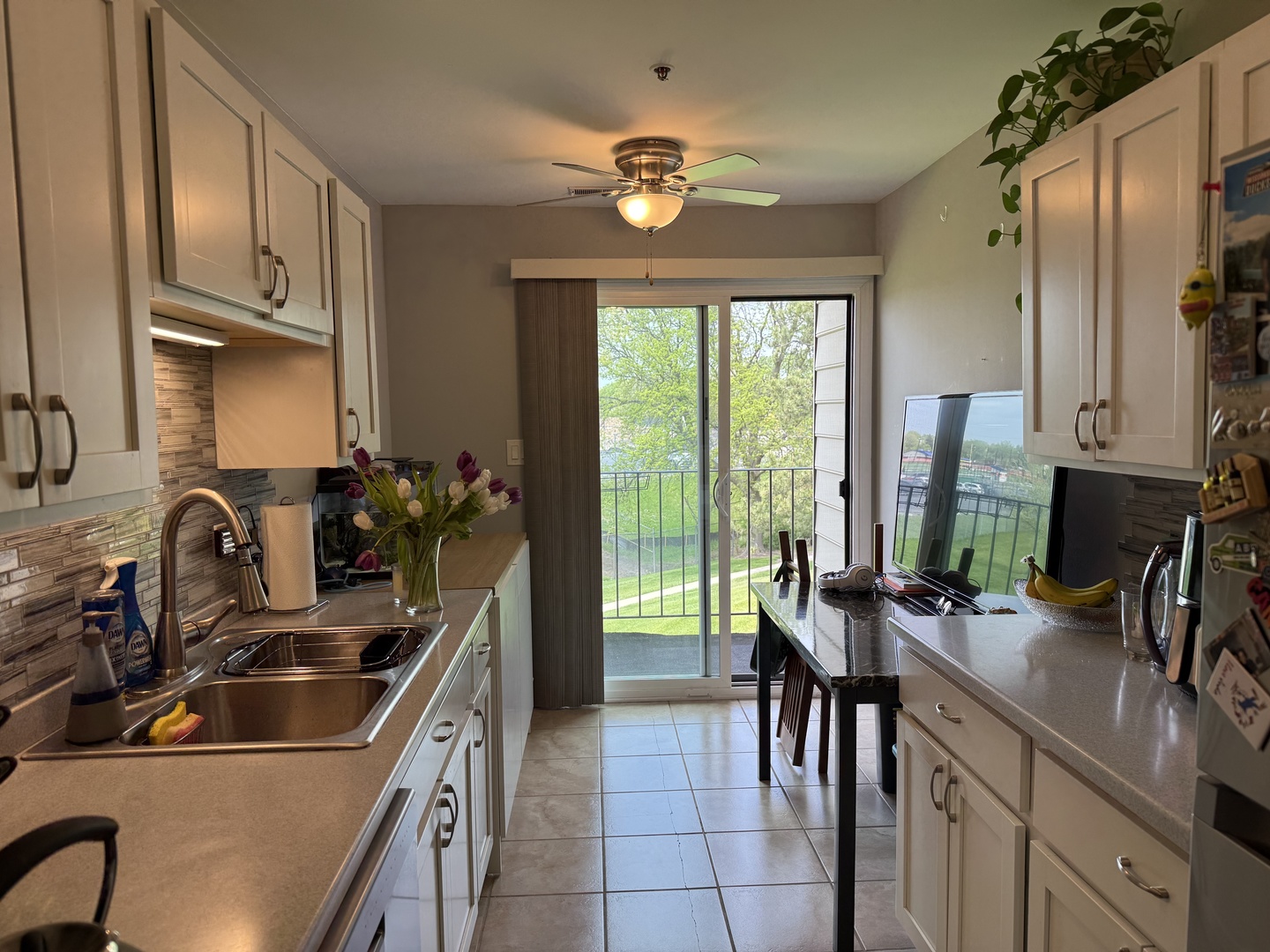 740 Weidner Road, Unit 206 Buffalo Grove, IL 60089 - Photo 6 of 24 a kitchen with a sink stove and cabinets