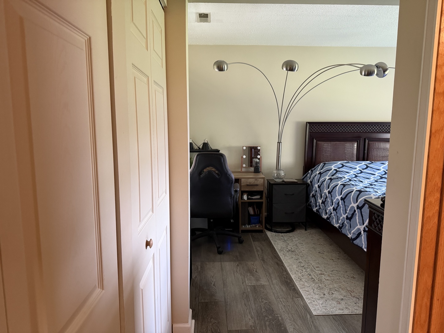 740 Weidner Road, Unit 206 Buffalo Grove, IL 60089 - Photo 10 of 24 a bedroom with a bed next to a window with chair